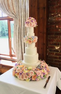 Grand wedding cake with fresh flowers, Westerham Golf Club, Kent